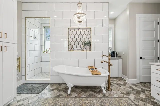 a view of a livingroom with furniture and a flat screen tv