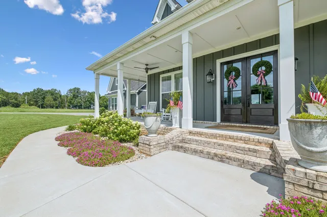 a spacious bedroom with a bed and a window