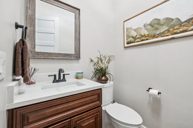 a living room with furniture flat screen tv and a fireplace