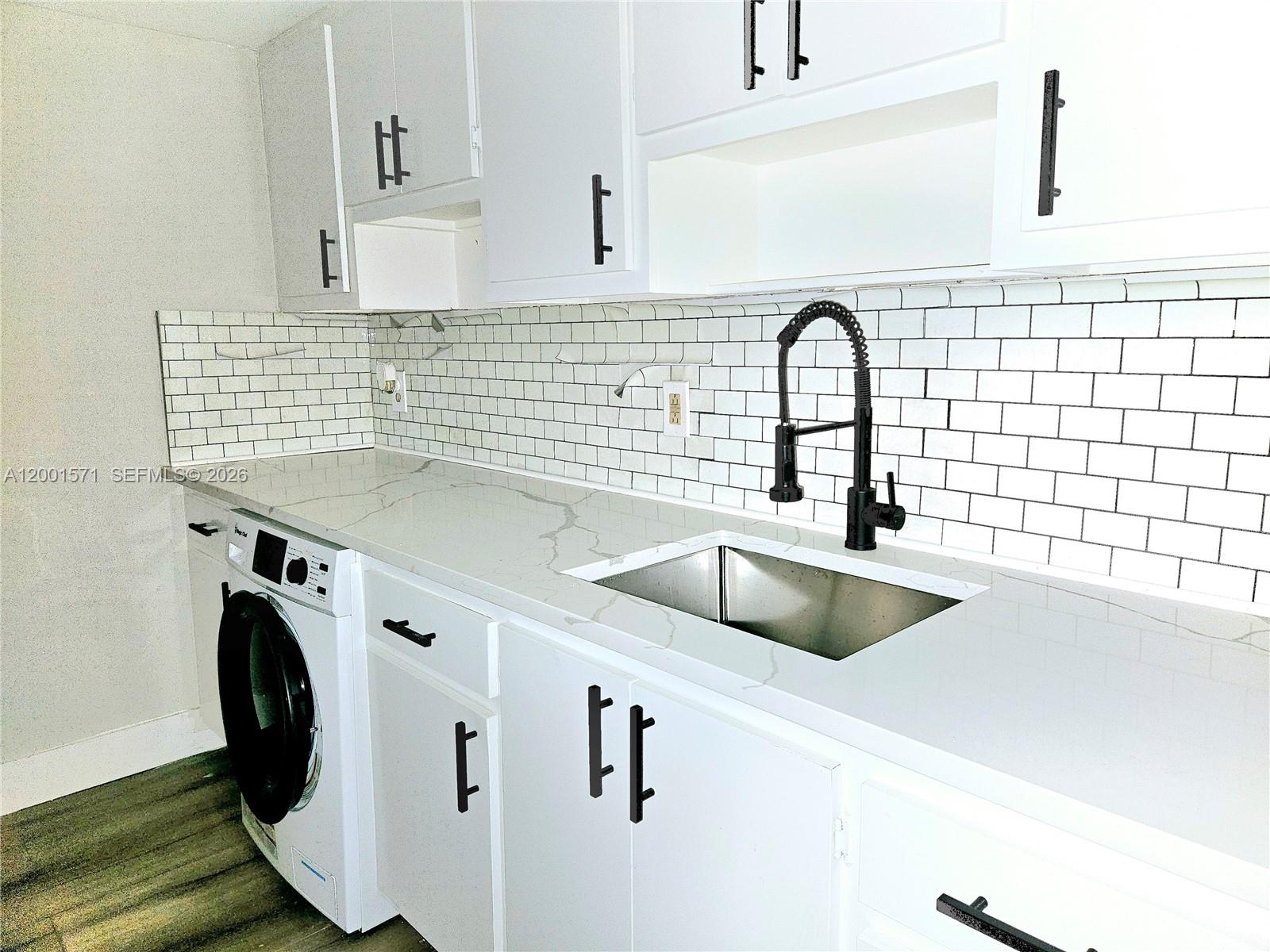 335 Southwest 20th Street, Unit 8 Fort Lauderdale, FL 33315 - Photo 6 of 11 a close view of sink and tap