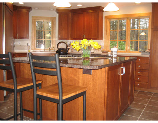 223 Littleton County Road Harvard, MA 01451 - Photo 9 of 26 a kitchen with granite countertop next to a window