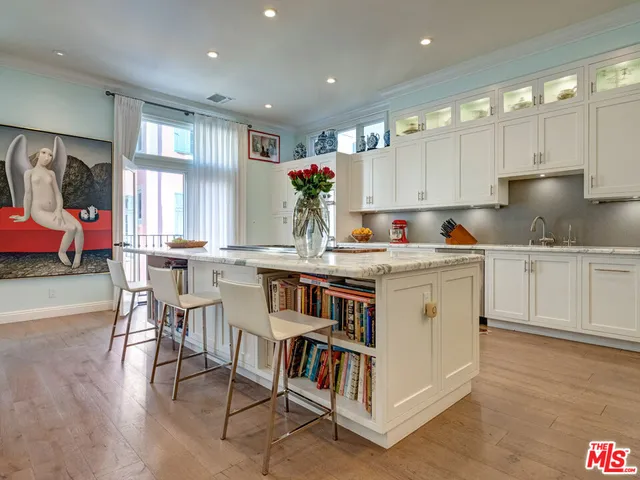 a view of kitchen with furniture and wooden floor