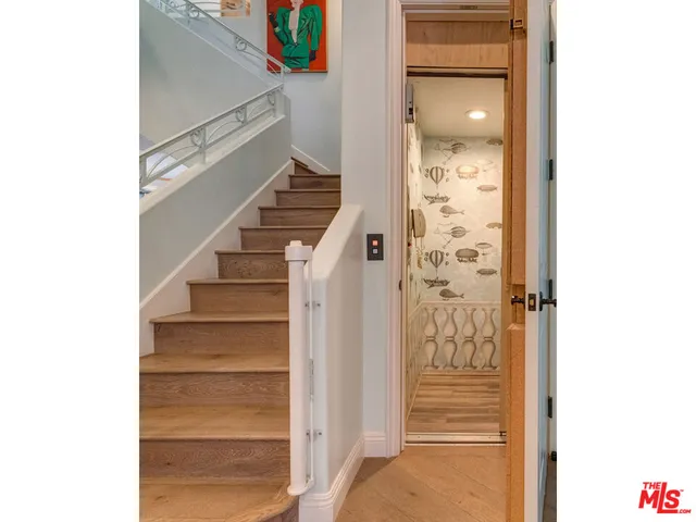 a bedroom with a bed and a fireplace