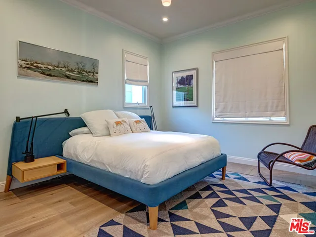 a bathroom with a sink and mirror with toilet