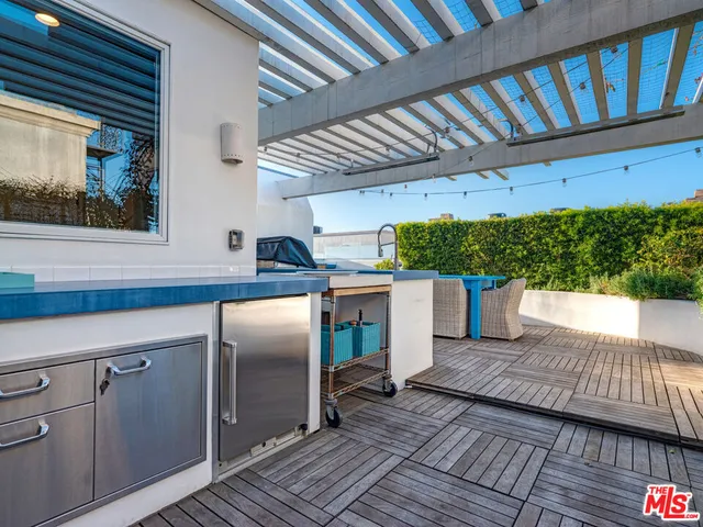 a view of a couches on the roof deck