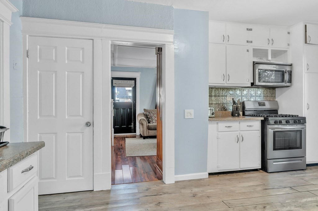 63 Freeman Terrace Springfield, MA 01104 - Photo 13 of 41 a kitchen with stainless steel appliances granite countertop a refrigerator and a stove top oven