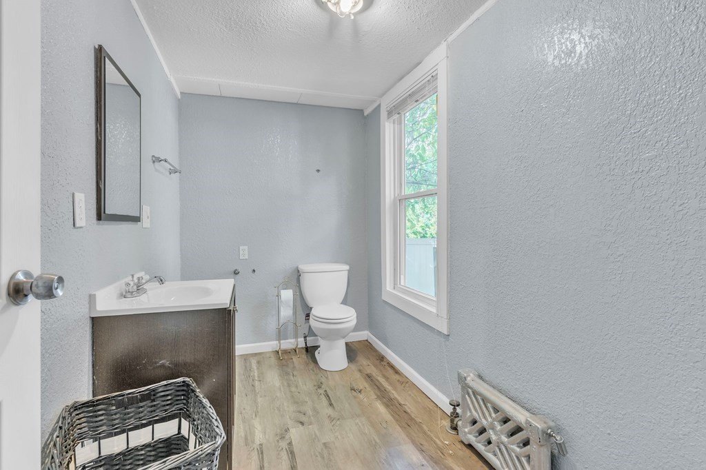 63 Freeman Terrace Springfield, MA 01104 - Photo 22 of 41 a bathroom with a toilet a sink and a window
