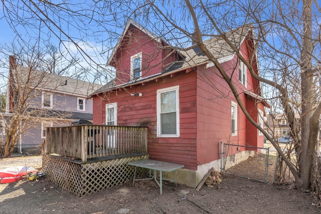 63 Freeman Terrace Springfield, MA 01104 - Photo 4 of 41 a view of a house with a yard and wooden fence