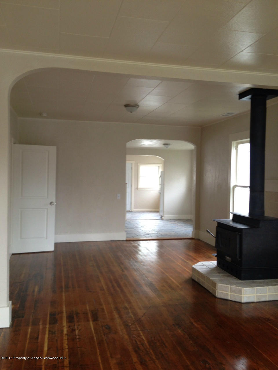329 East 4th Street Rifle, CO 81650 - Photo 3 of 7 a view of a livingroom with wooden floor