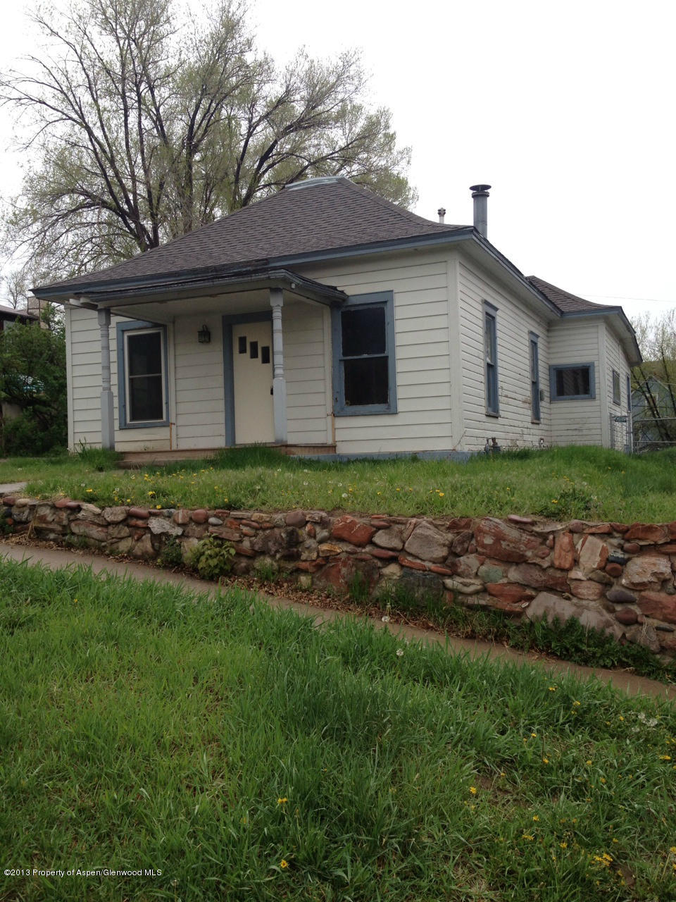 329 East 4th Street Rifle, CO 81650 - Photo 6 of 7 a front view of a house with garden