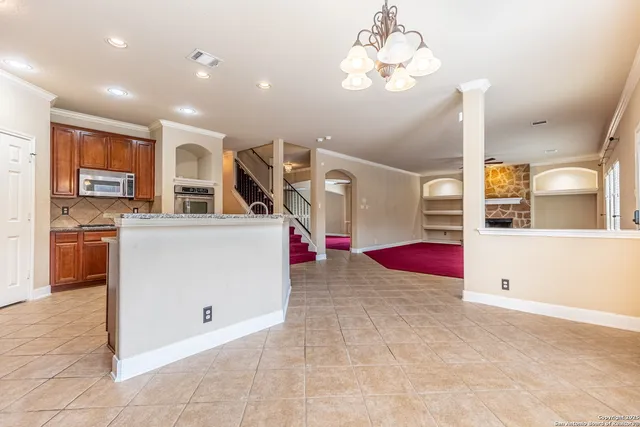 a view of a living room and kitchen