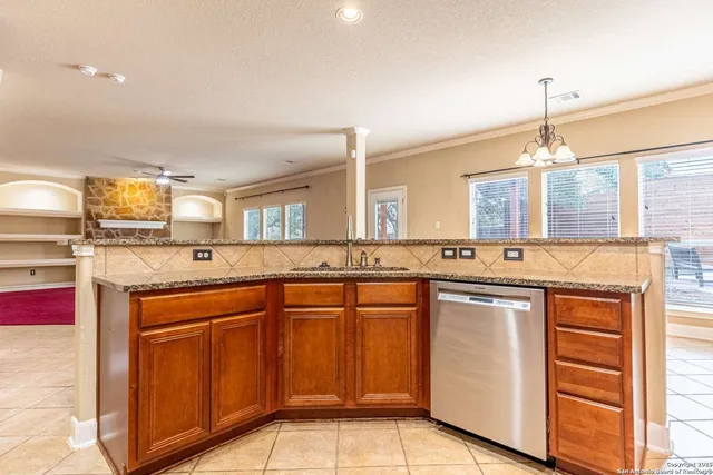 a kitchen with a sink and cabinets