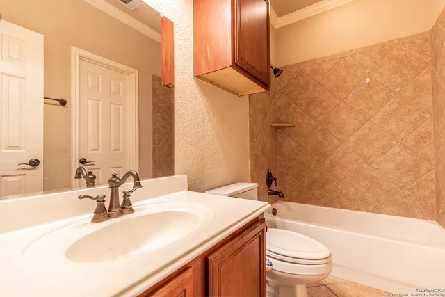 a bathroom with a sink a toilet and a bathtub