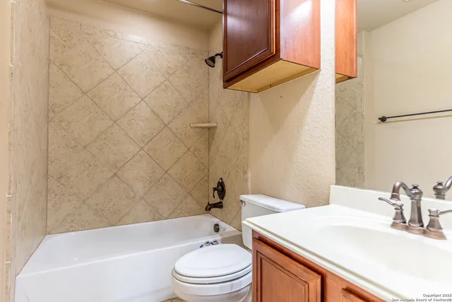 a bathroom with a sink a toilet and a bathtub