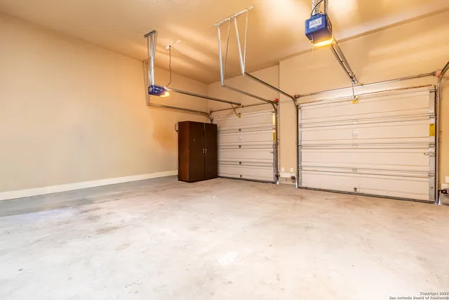 a view of a backyard with a tree