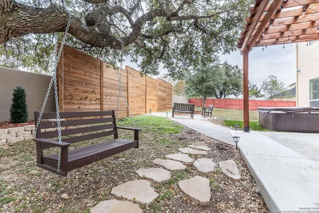 a backyard of a house with a yard and garage