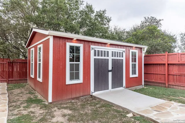 a view of an empty room with windows
