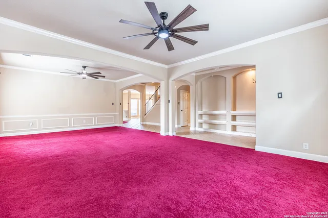 a view of livingroom with hardwood floor and a ceiling fan