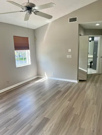 a bathroom with a double vanity sink toilet and a mirror