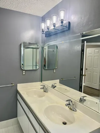 a bathroom with a sink a toilet and a bathtub