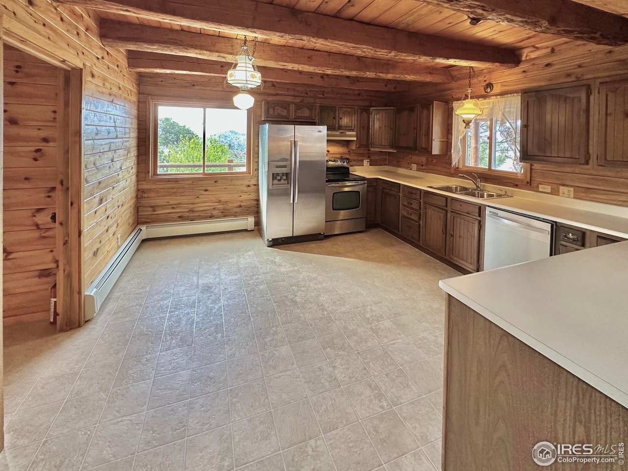 2004 Bonner Springs Ranch Road Laporte, CO 80535 - Photo 13 of 40 Wide open kitchen with massive wooden beams!