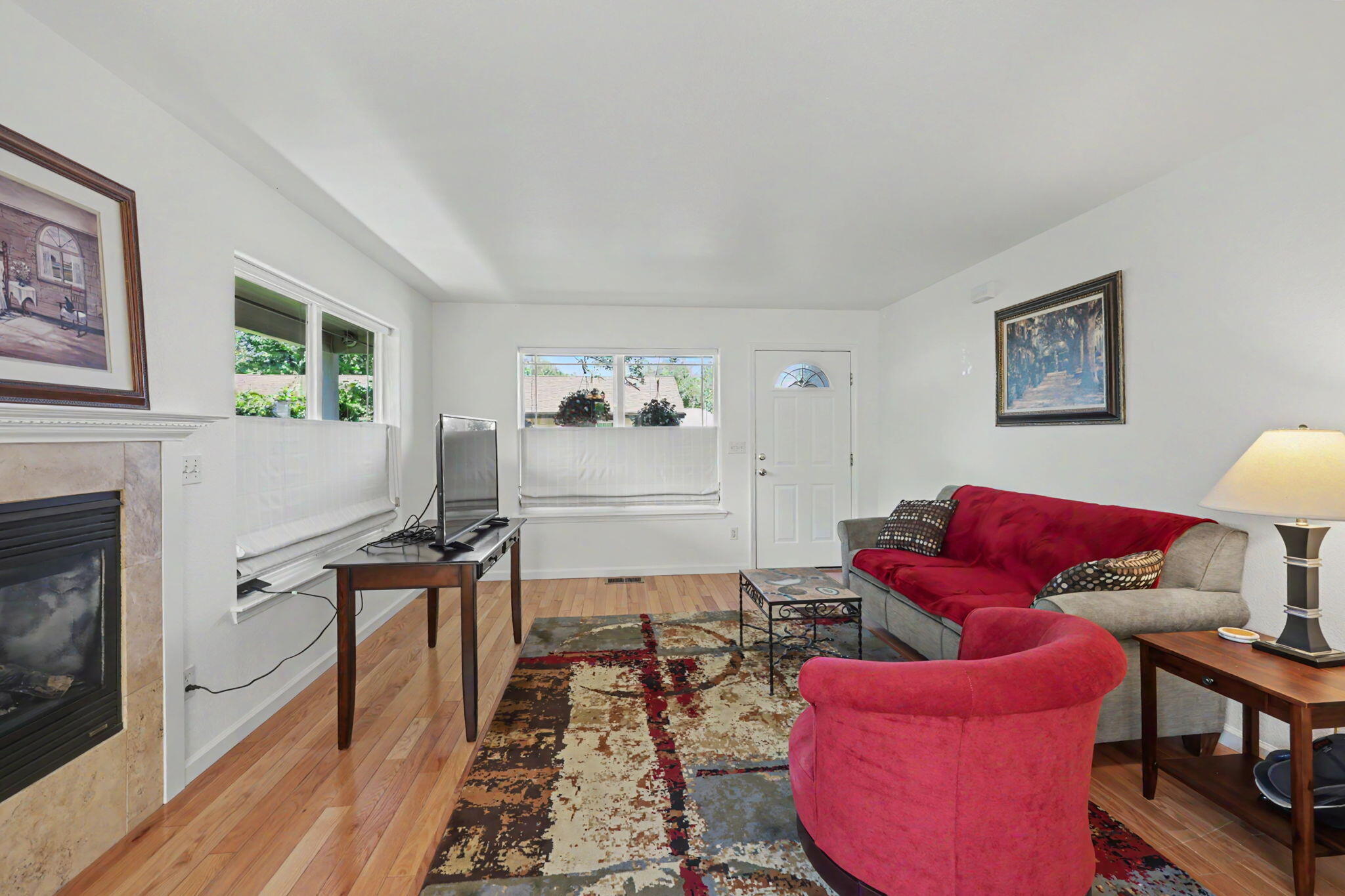 228 Talent Avenue, Unit 4 Talent, OR 97540 - Photo 9 of 23 Gas fireplace with stone surround