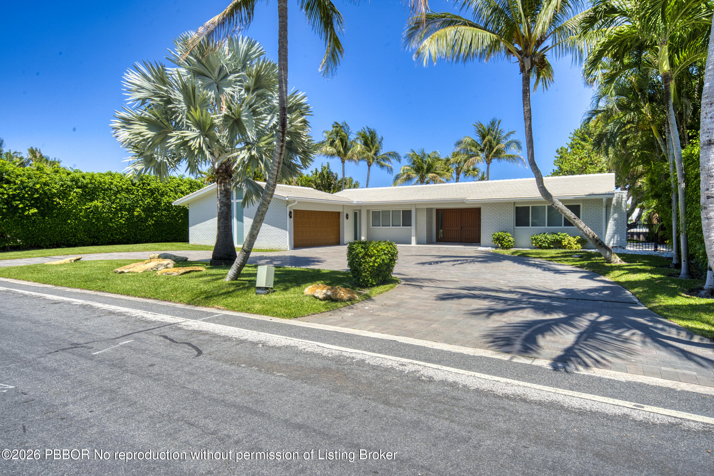 2259 Ibis Isle Road East, Unit E Palm Beach, FL 33480 - Photo 1 of 28 a view of a house with backyard and a tree