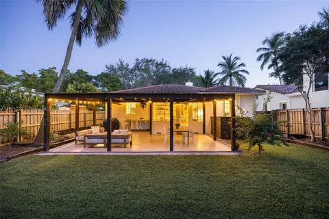 a view of outdoor space with seating area and lake view