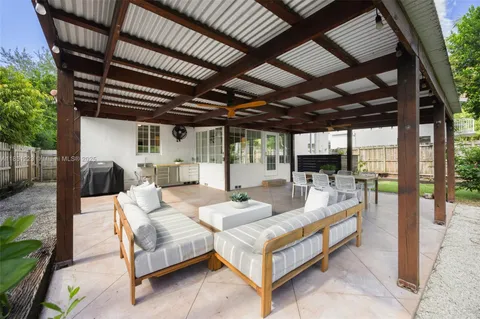 a outdoor space with patio lots of furniture and garden view