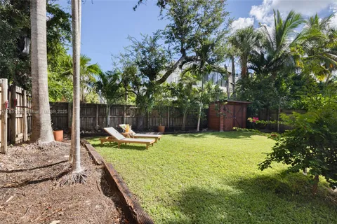 a view of a backyard with a patio