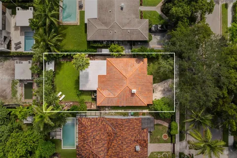 an aerial view of a house with a garden