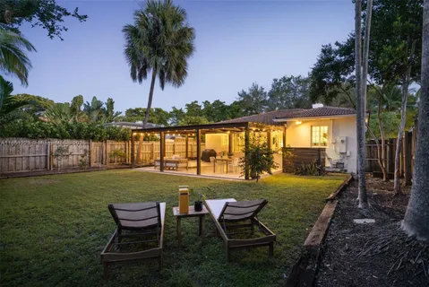 a view of a swimming pool and lounge chair