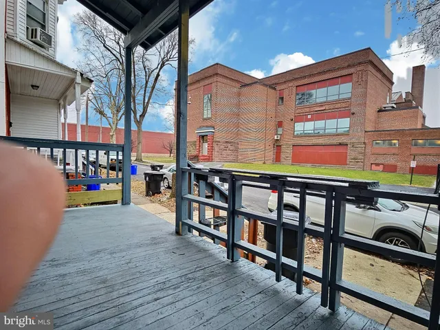 a view of a brick building with many windows