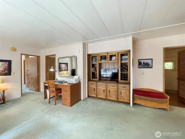 a large bedroom with a large bed and furniture