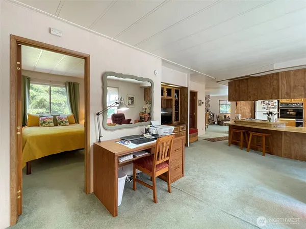 a view of a workspace with furniture and a livingroom