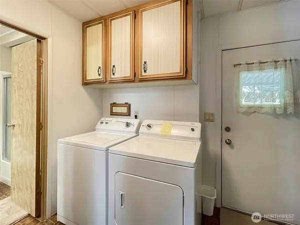 a utility room with dryer and washer