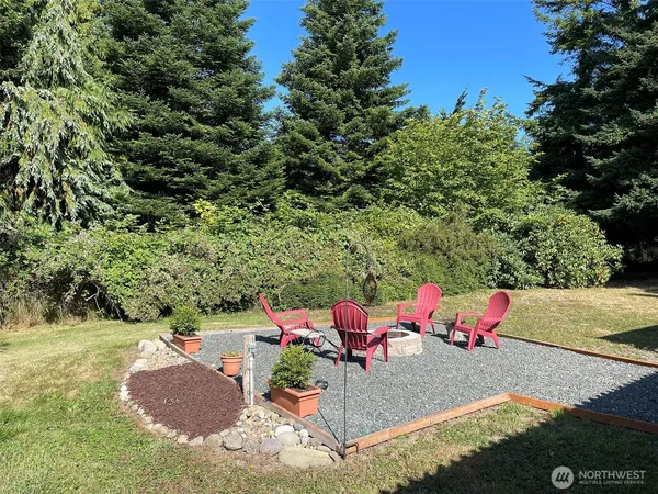 a view of a backyard with sitting area