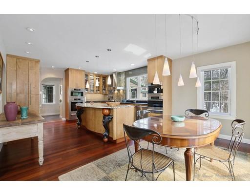 191 Middle Road Newbury, MA 01922 - Photo 8 of 30 a open kitchen with stainless steel appliances kitchen island granite countertop a table and chairs in it