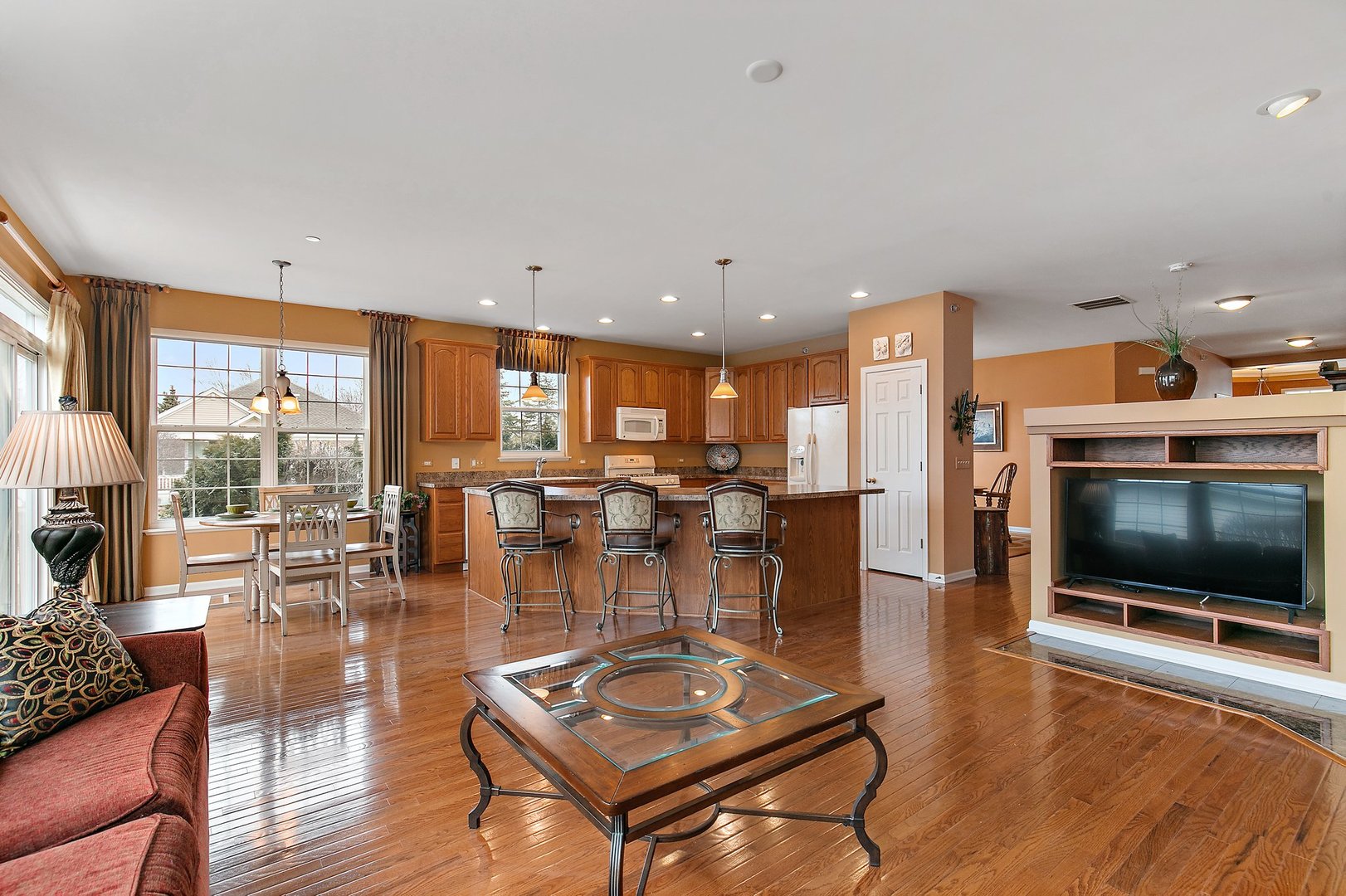 5876 Leeds Road Hoffman Estates, IL 60192 - Photo 13 of 37 a living room with furniture and a flat screen tv