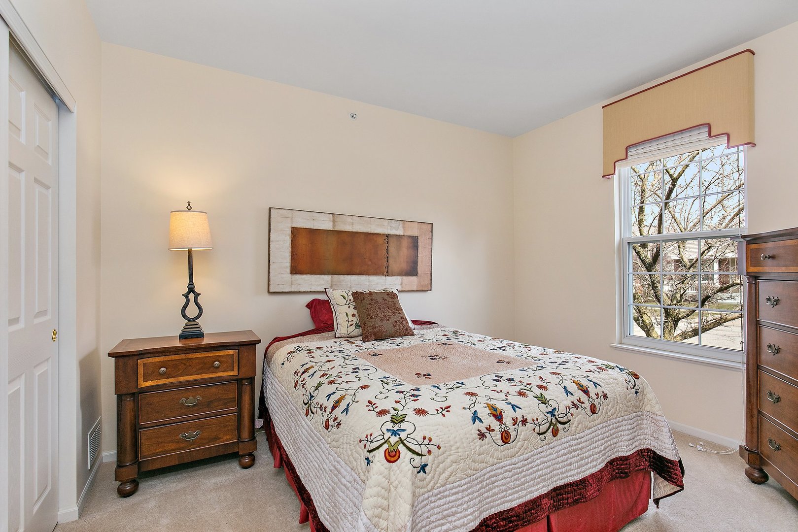 5876 Leeds Road Hoffman Estates, IL 60192 - Photo 19 of 37 a bedroom with a bed and a night stand