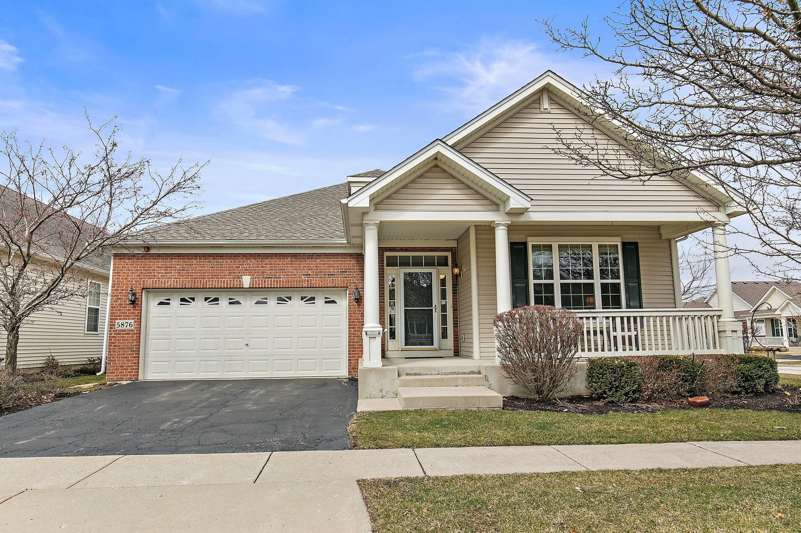 5876 Leeds Road Hoffman Estates, IL 60192 - Photo 2 of 37 a front view of a house with a yard