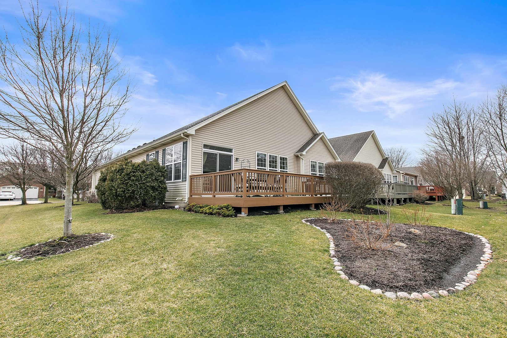5876 Leeds Road Hoffman Estates, IL 60192 - Photo 23 of 37 a view of a house with a yard patio and fire pit