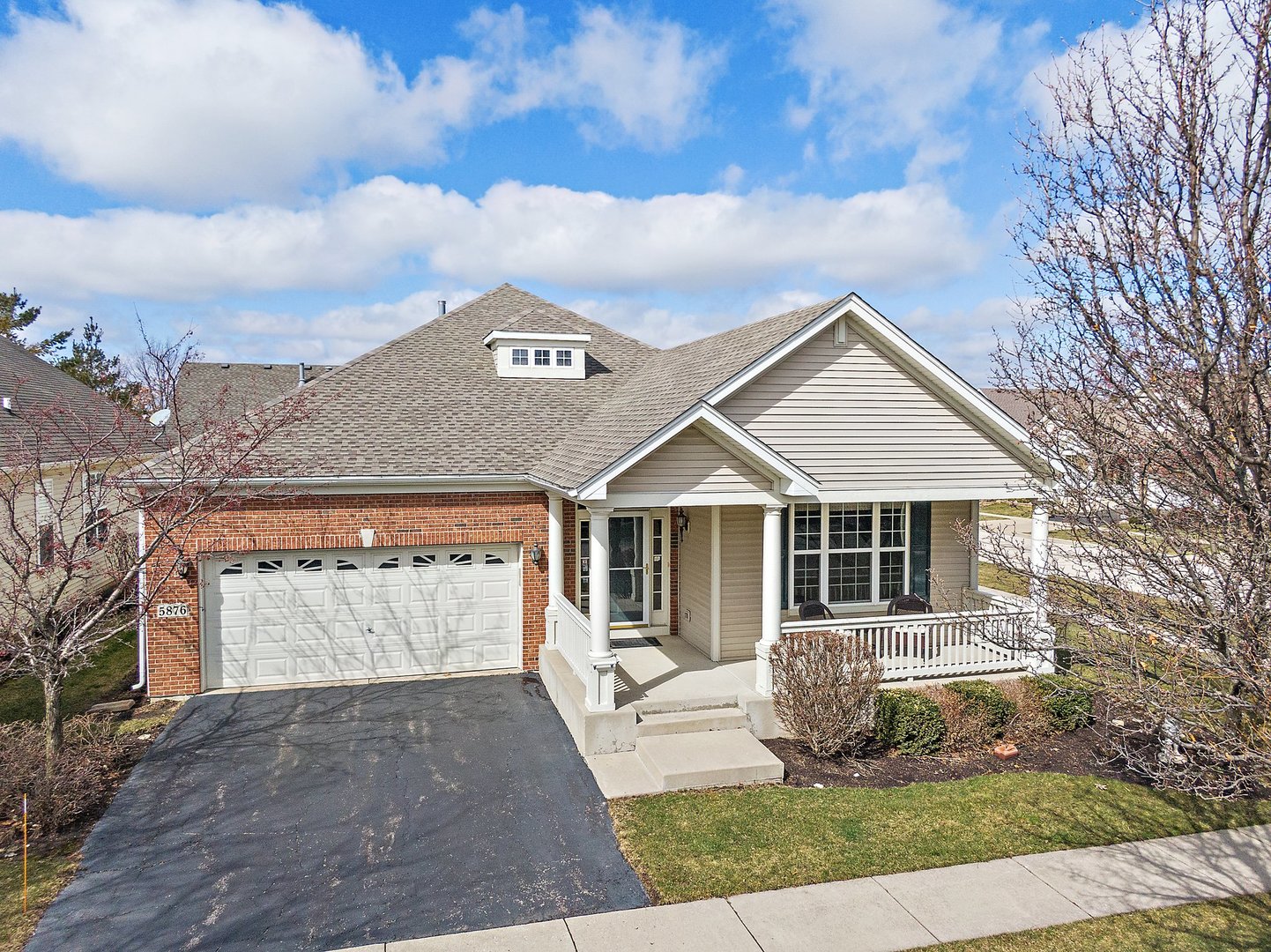 5876 Leeds Road Hoffman Estates, IL 60192 - Photo 32 of 37 a front view of a house with a yard and garage