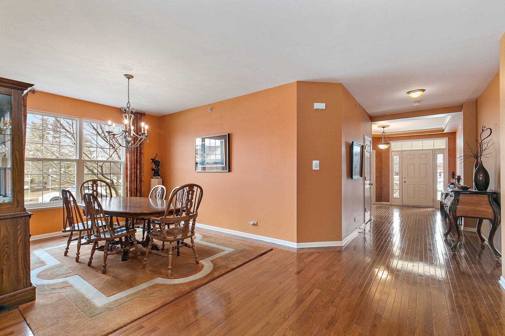 5876 Leeds Road Hoffman Estates, IL 60192 - Photo 6 of 37 a view of a dining room with furniture window and wooden floor