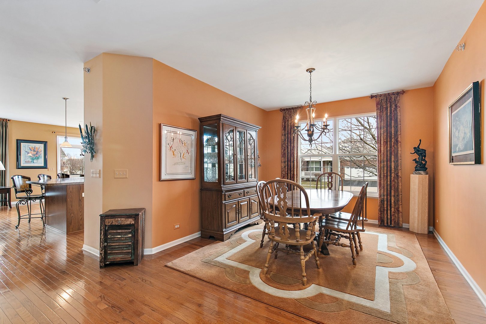 5876 Leeds Road Hoffman Estates, IL 60192 - Photo 8 of 37 a view of a dining room with furniture window and wooden floor