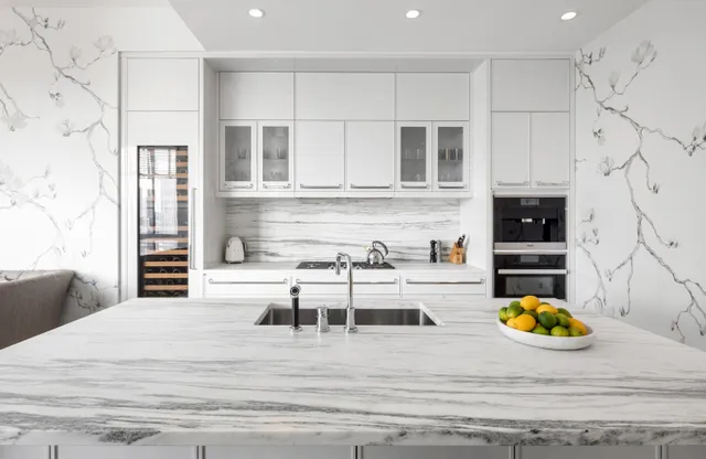 a kitchen with a table chairs stove and cabinets