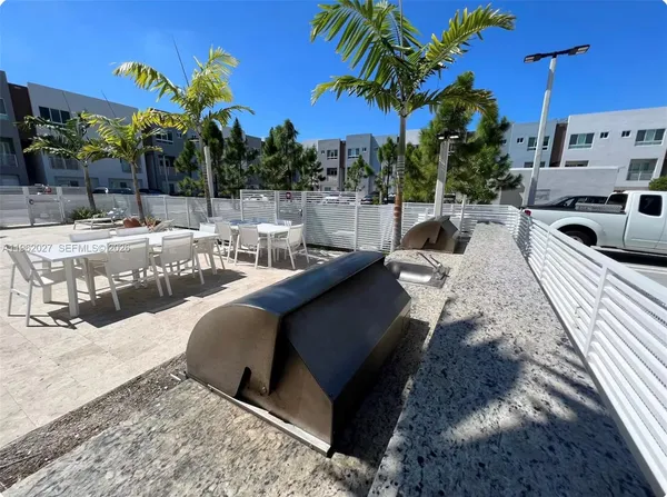 a view of a patio with swimming pool