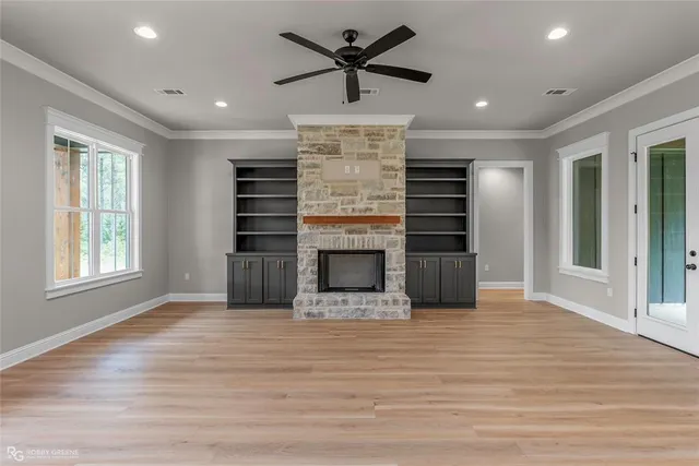 a living room with furniture flat screen tv and a fireplace
