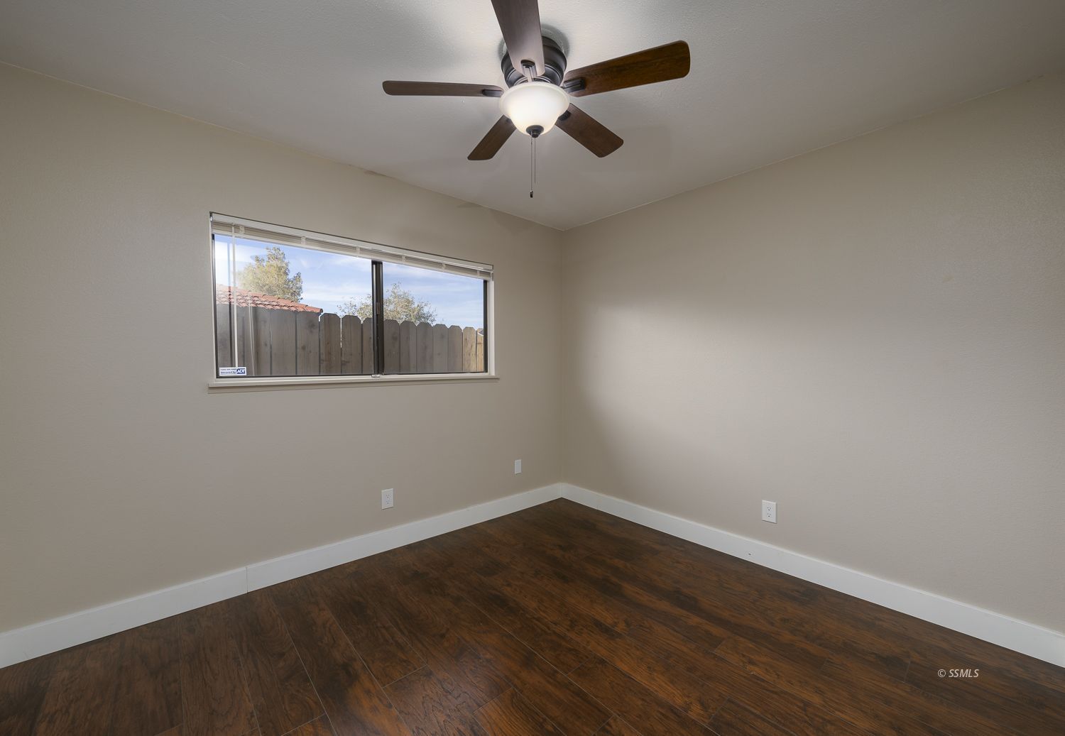 436 South Lincoln Street Ridgecrest, CA 93555 - Photo 15 of 34 a view of empty room with wooden floor and fan