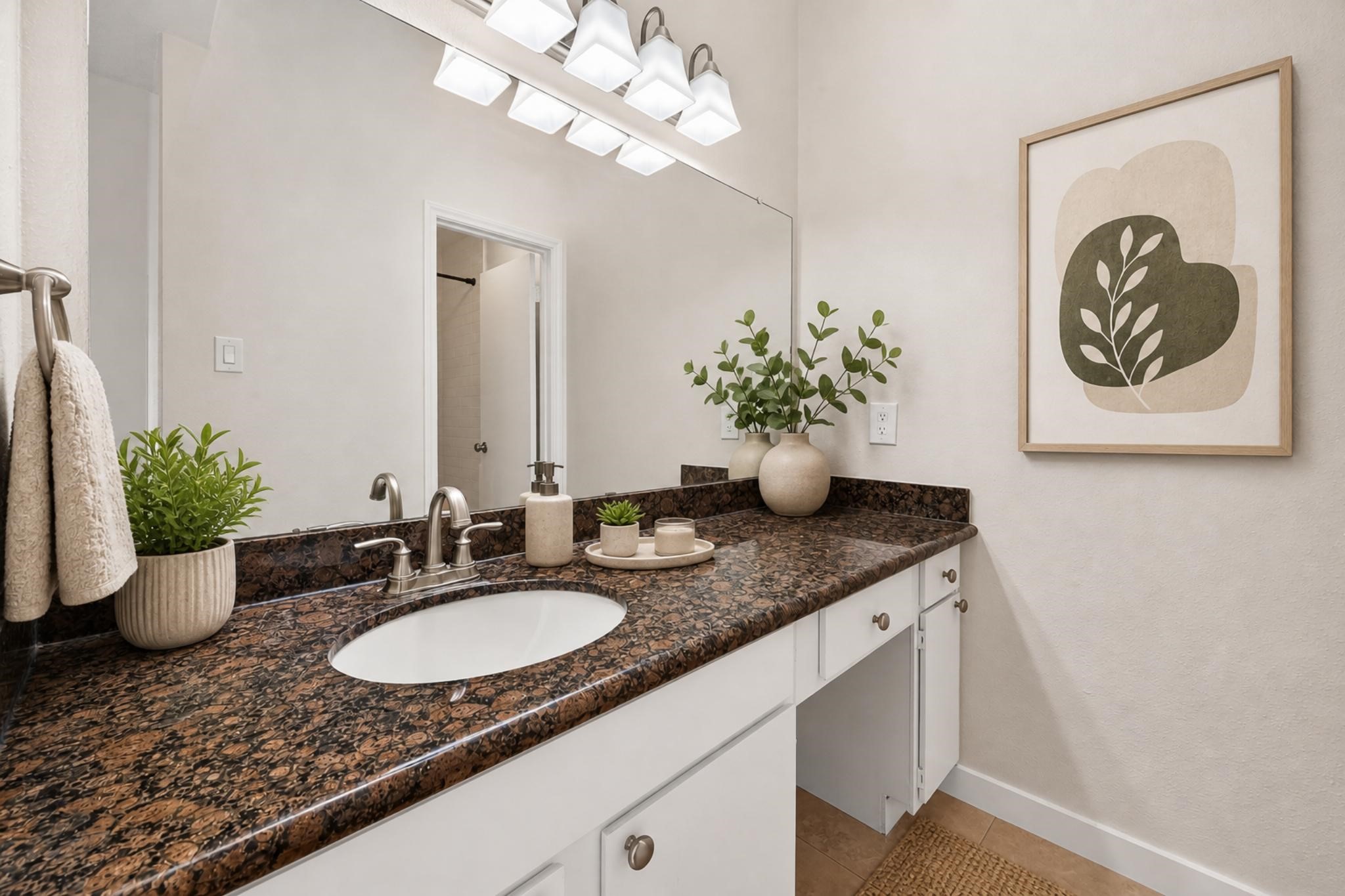 2211 South Kirkwood Road, Unit 68 Houston, TX 77077 - Photo 12 of 14 “Updated bathroom featuring a spacious vanity with granite countertops, modern fixtures, and bright lighting, offering a clean and functional space.”